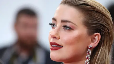 Amber Heard with her children, celebrating the arrival of twins