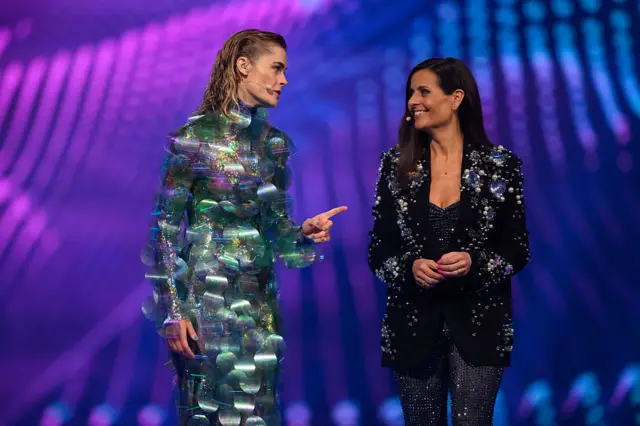 Crowd celebrating Eurovision contest with flags—ESC vote excitement