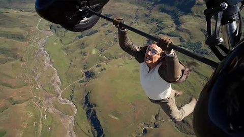 Tom Cruise performing a daring stunt in Mission: Impossible, showcasing dead reckoning in action