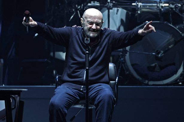 Phil Collins shares a moment with his son during a rare public appearance after health updates