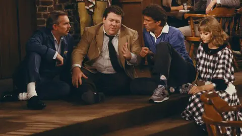 George Wendt as Norm Peterson on Cheers